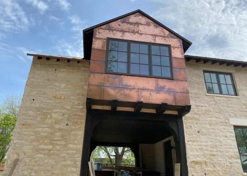Copper metal panel facade on a stone building for Skylight Installation in Roselle Park